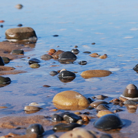 Buy canvas prints of  Rocks on the beach by Michael Boyle