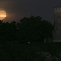 Buy canvas prints of  Full supermoon rising by the Clifton Observatory, by Caroline Hillier