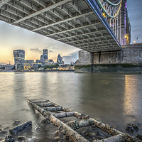 Buy canvas prints of  Tower Bridge from underneath at low tide by Dan Hamilton
