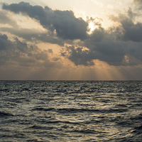 Buy canvas prints of Sun rays over the ocean by Claire Castelli
