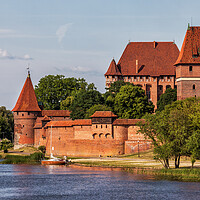 Buy canvas prints of Malbork Castle at Nogat River in Poland by Artur Bogacki