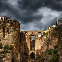 Buy canvas prints of Stormy Sky Above Ronda Bridge In Spain by Artur Bogacki