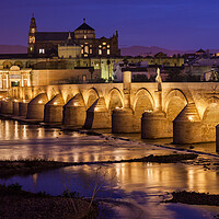 Buy canvas prints of Bridge and Mosque Cathedral of Cordoba at Night by Artur Bogacki