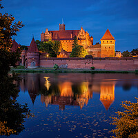 Buy canvas prints of Malbork Castle by Night in Poland by Artur Bogacki