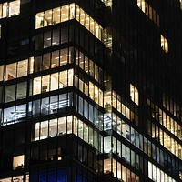 Buy canvas prints of Office Building Windows At Night Corporate Background by Artur Bogacki