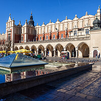 Buy canvas prints of Fountain and Cloth Hall on Main Square in Krakow by Artur Bogacki