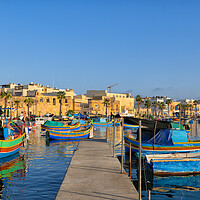 Buy canvas prints of Boats in Marsaxlokk Fishing Village Port in Malta by Artur Bogacki