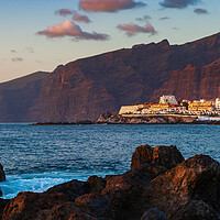 Buy canvas prints of Los Gigantes Cliffs And Town At Sunset by Artur Bogacki