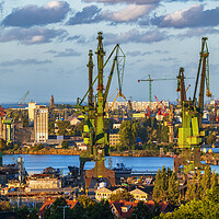 Buy canvas prints of Gdansk Shipyard Cranes At Sunset In Poland by Artur Bogacki