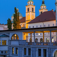 Buy canvas prints of Ljubljana Cathedral and Plecnik Arcades at Dusk by Artur Bogacki