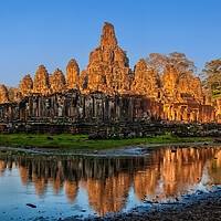 Buy canvas prints of Bayon Temple At Sunset In Cambodia by Artur Bogacki