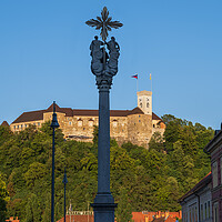 Buy canvas prints of Holy Trinity Column And Ljubljana Castle by Artur Bogacki