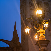Buy canvas prints of Fuente De La Farola Lamp Against Giralda Tower In Seville by Artur Bogacki