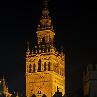 Buy canvas prints of Giralda Bell Tower Of Seville Cathedral At Night by Artur Bogacki