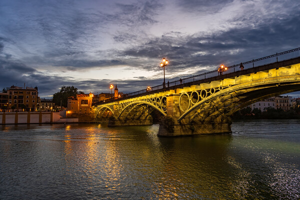 Evening at Triana Bridge in Seville Picture Board by Artur Bogacki