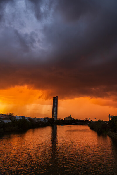 Storm Clouds Above Guadalquivir River In Seville Picture Board by Artur Bogacki