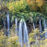Buy canvas prints of Autumn Foliage and Waterfall by Artur Bogacki