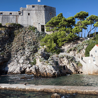 Buy canvas prints of Fort Lovrijenac and Bay Pier in Dubrovnik by Artur Bogacki