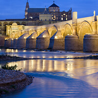 Buy canvas prints of Roman Bridge on Guadalquivir River at Dawn by Artur Bogacki