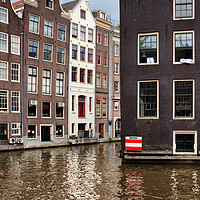 Buy canvas prints of Canal Houses In Amsterdam by Artur Bogacki