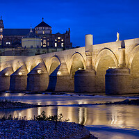 Buy canvas prints of Roman Bridge and Mosque Cathedral in Cordoba by Artur Bogacki