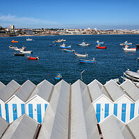 Buy canvas prints of Sheds and Boats Moored at Bay in Cascais by Artur Bogacki