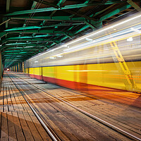 Buy canvas prints of Bridge With Tram Light Trails In Warsaw by Artur Bogacki