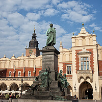 Buy canvas prints of Adam Mickiewicz Monument and Sukiennice in Krakow by Artur Bogacki