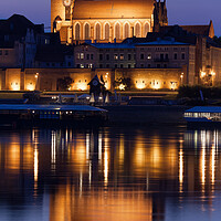 Buy canvas prints of Torun Cathedral With Reflection In River by Artur Bogacki
