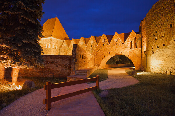 Teutonic Knights Castle at Night in Torun Picture Board by Artur Bogacki