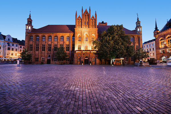 Town Hall in Torun at Dusk Picture Board by Artur Bogacki