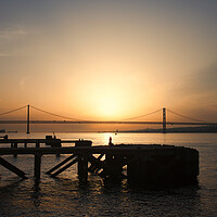 Buy canvas prints of Sunset at Almada Quay and 25 de Abril Bridge in Lisbon by Artur Bogacki