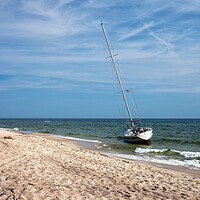 Buy canvas prints of Lonely Sail Boat Moored At Baltic Sea Beach by Artur Bogacki