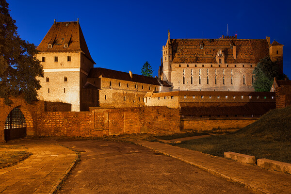 Malbork Castle at Night in Poland Picture Board by Artur Bogacki