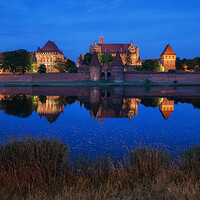 Buy canvas prints of Malbork Castle at Night in Poland by Artur Bogacki