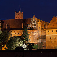 Buy canvas prints of High Castle of the Malbork Castle at Night by Artur Bogacki
