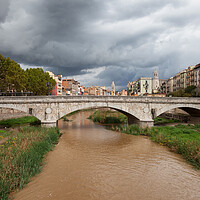 Buy canvas prints of Stone Bridge on River Onyar in Girona by Artur Bogacki