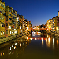 Buy canvas prints of Waterside Houses in City of Girona at Night by Artur Bogacki