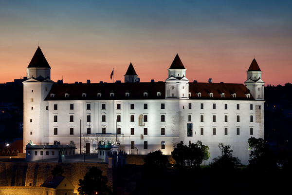 Bratislava Castle Illuminated at Dusk in Slovakia Picture Board by Artur Bogacki