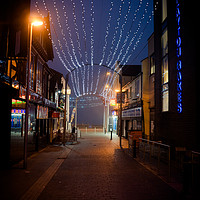 Buy canvas prints of Back Alley during Blackpool illuminations by David Graham