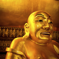 Buy canvas prints of Lucky smiling Buddha of Wat Pho, Bangkok, Thailand by Julian Bound