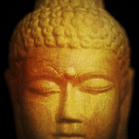 Buy canvas prints of Thai Buddha statue with golden and orange tones by Julian Bound