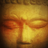 Buy canvas prints of  Thai Buddha statue with golden and orange tones by Julian Bound