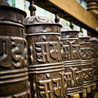 Buy canvas prints of Tibetan Buddhist prayer wheels of Boudhanath stupa by Julian Bound