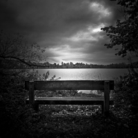 Buy canvas prints of  A lone bench in Ellesmere, Shropshire by Julian Bound