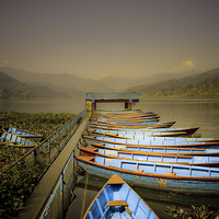 Buy canvas prints of Boats on Phewa Lake, Pokhara, Nepal by Julian Bound