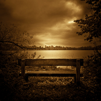 Buy canvas prints of   A lone bench in Ellesmere, Shropshire by Julian Bound