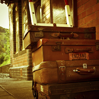 Buy canvas prints of  Old fashioned luggage on a train station in Llang by Julian Bound