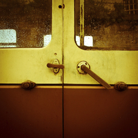 Buy canvas prints of Train carriage doors on a train station in Llangol by Julian Bound