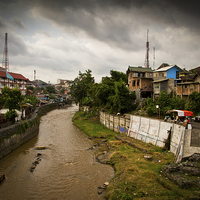 Buy canvas prints of  Riverside slums of Yogyakarta, Indonesia by Julian Bound